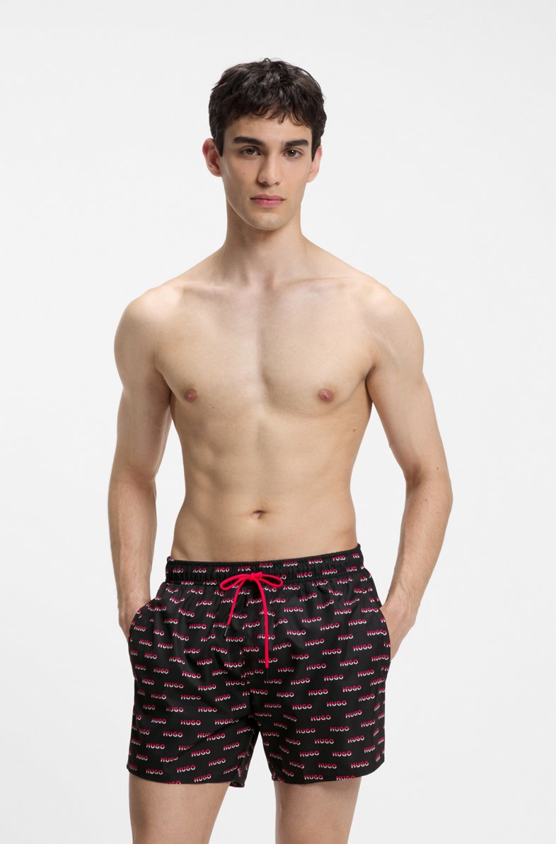 HUGO SWIM SHORTS WITH ALL-OVER SPLIT-LOGO PRINT