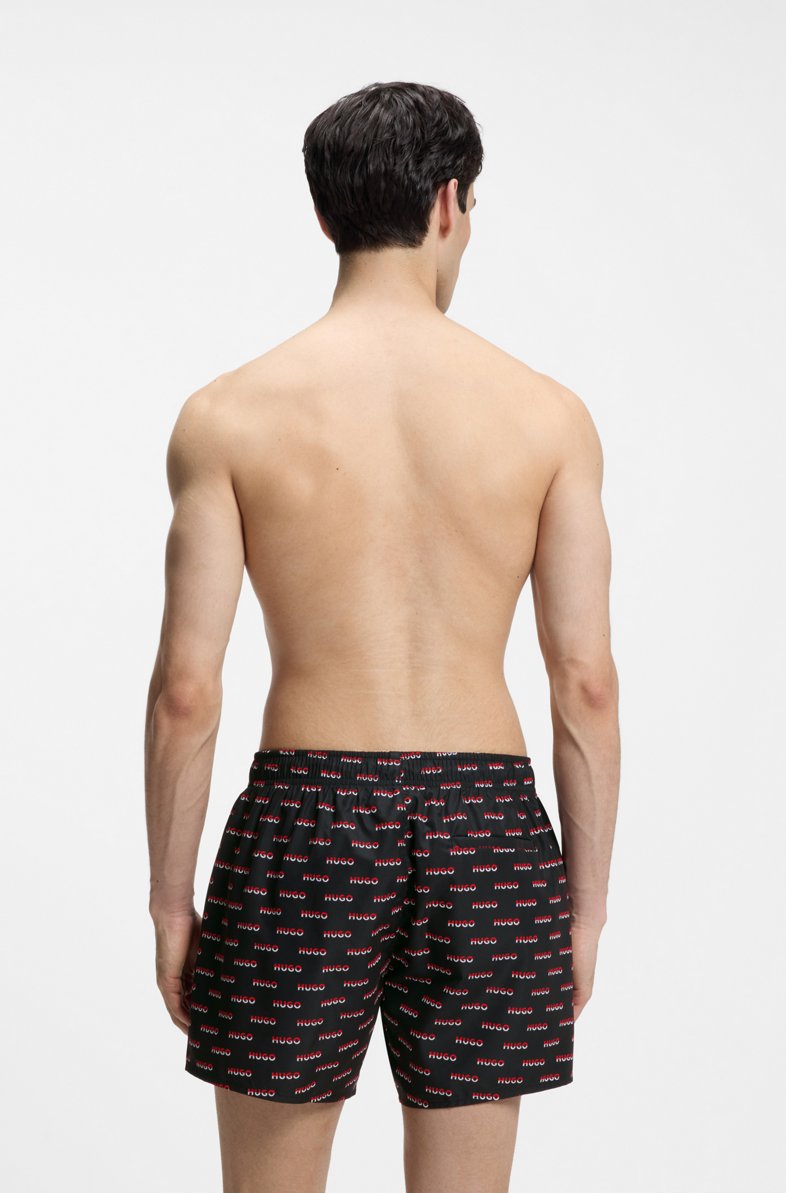 HUGO SWIM SHORTS WITH ALL-OVER SPLIT-LOGO PRINT